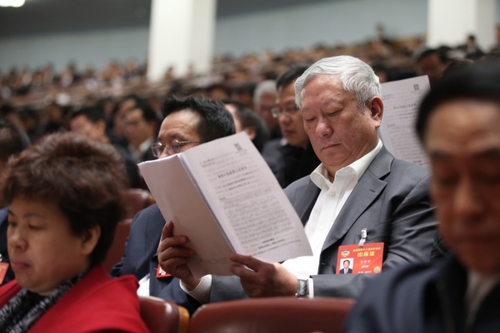 3月12日，十二屆全國人大五次會議在北京人民大會堂舉行第三次全體會議。這是全國政協委員列席會議。新華社記者 金立旺攝。